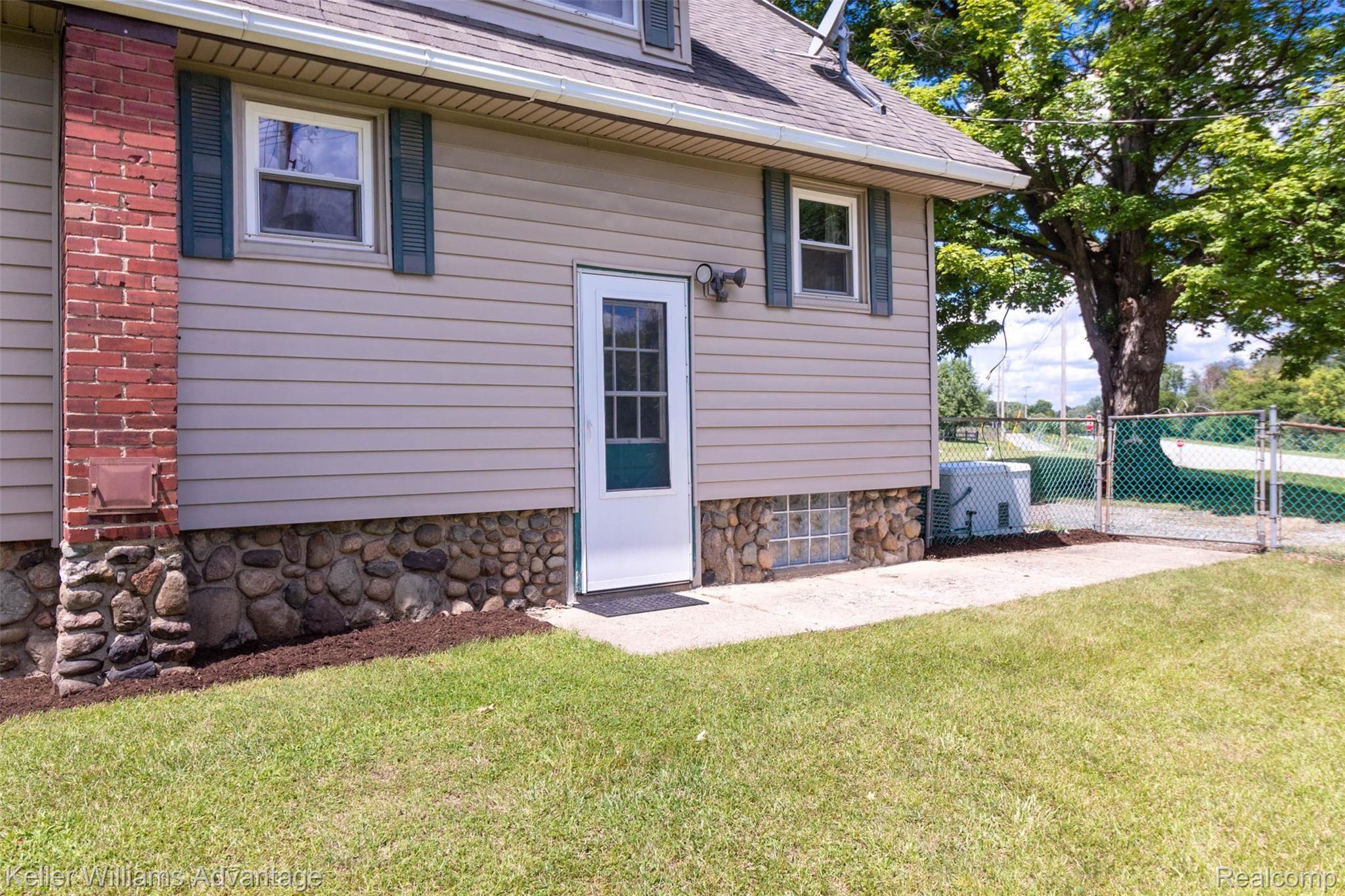 7953 Clark Lake Road Chelsea, MI 48118 - Photo 4 of 26 BACK OF HOUSE.jpg