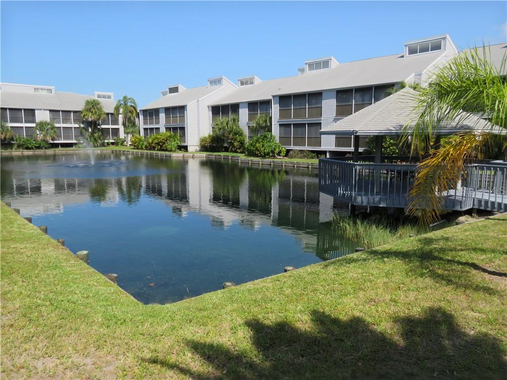 259 Fenwick Drive, Unit 33 Venice, FL 34285 - Photo 1 of 1 Your condo overlooks a pond with fish, turtles and regular bird visitors.