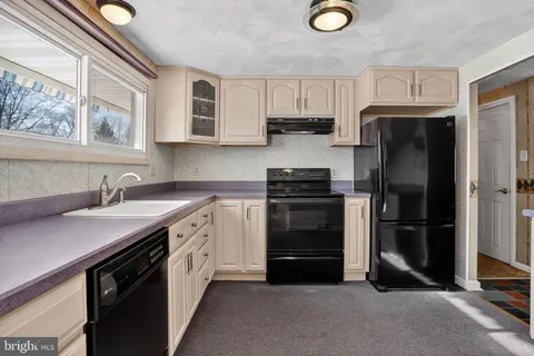 a view of cabinets and wooden floor