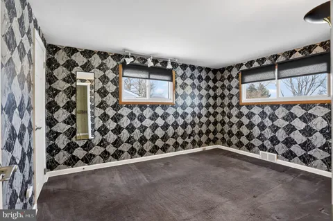 a view of an empty room with stairs