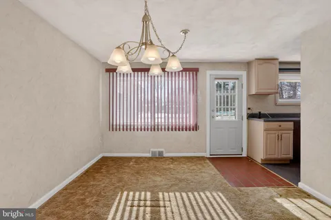 a view of cabinets a washer and dryer