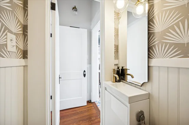 a view of bathroom with a sink and mirror