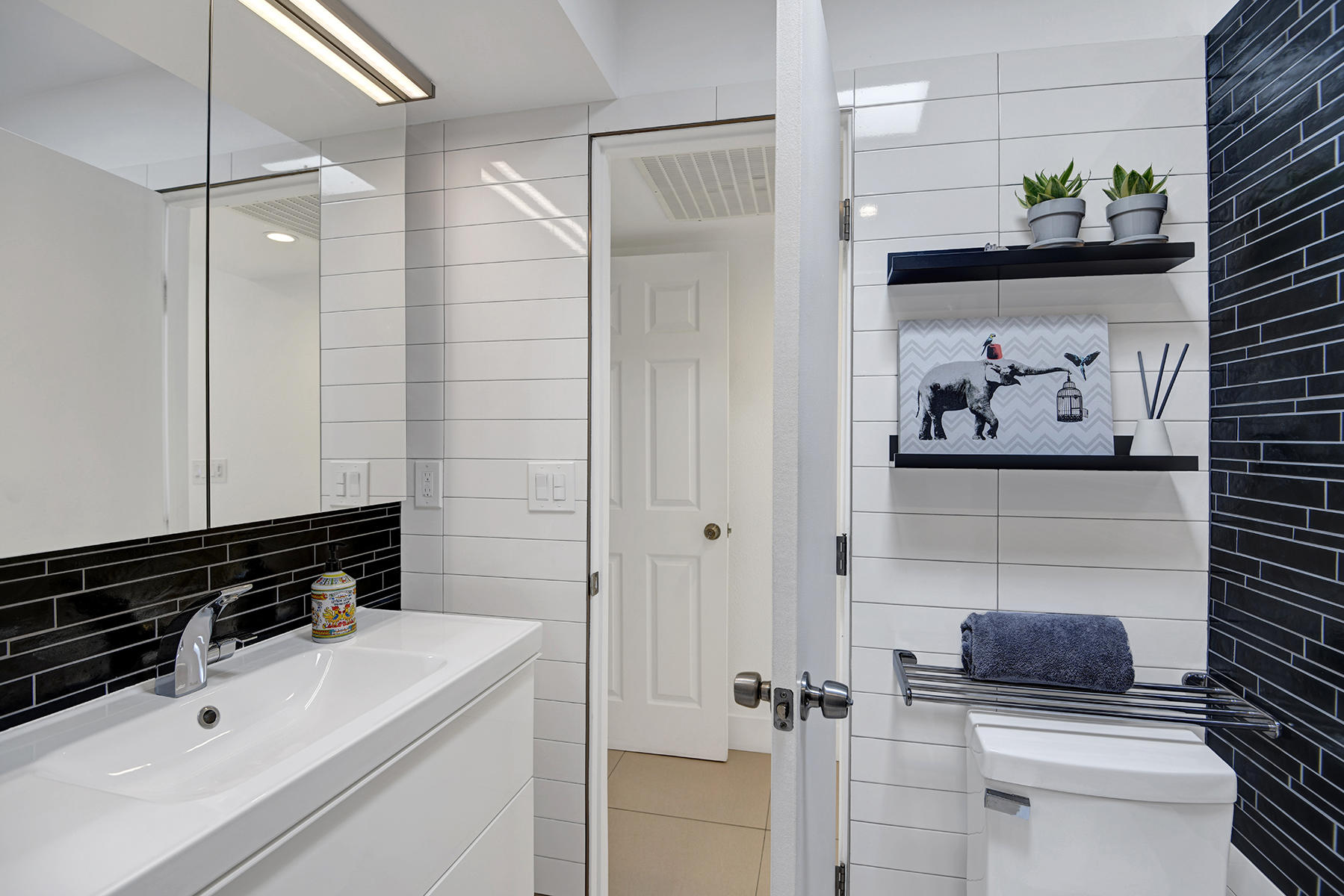 42379 Rancho Las Palmas Drive, Unit 29 Rancho Mirage, CA 92270 - Photo 12 of 24 a bathroom with a sink and a shower