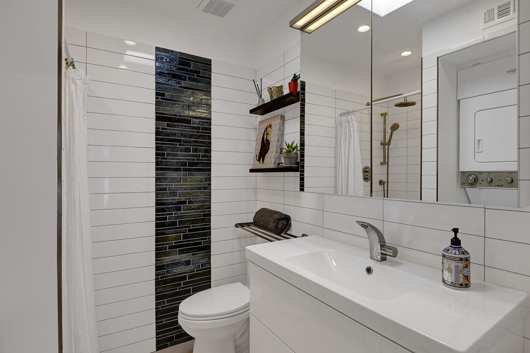 42379 Rancho Las Palmas Drive, Unit 29 Rancho Mirage, CA 92270 - Photo 15 of 24 a bathroom with a sink a toilet and shower