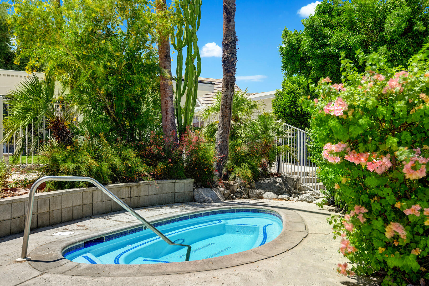 42379 Rancho Las Palmas Drive, Unit 29 Rancho Mirage, CA 92270 - Photo 22 of 24 a view of a swimming pool with a patio