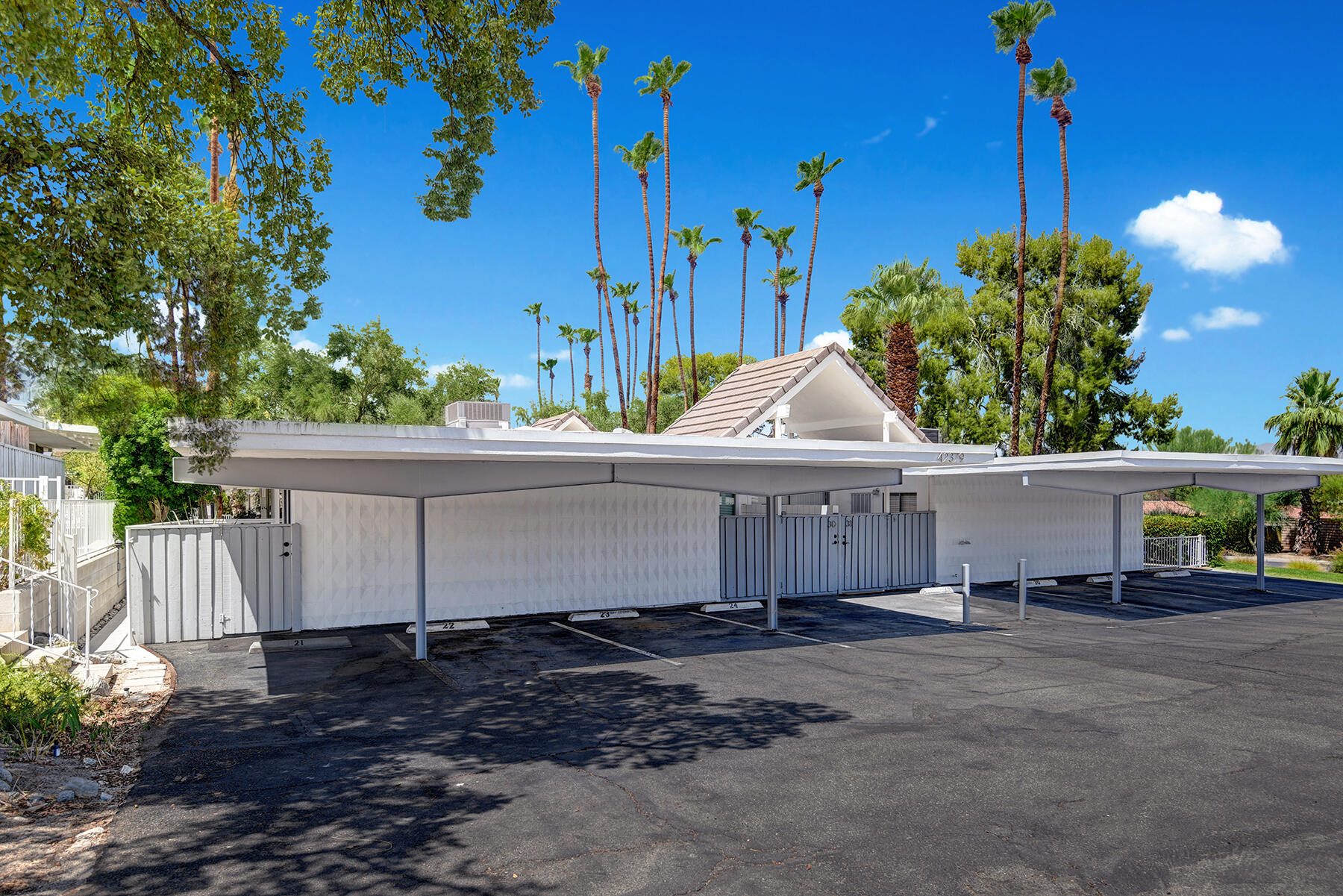 42379 Rancho Las Palmas Drive, Unit 29 Rancho Mirage, CA 92270 - Photo 23 of 24 a view of a house with a yard and potted plants