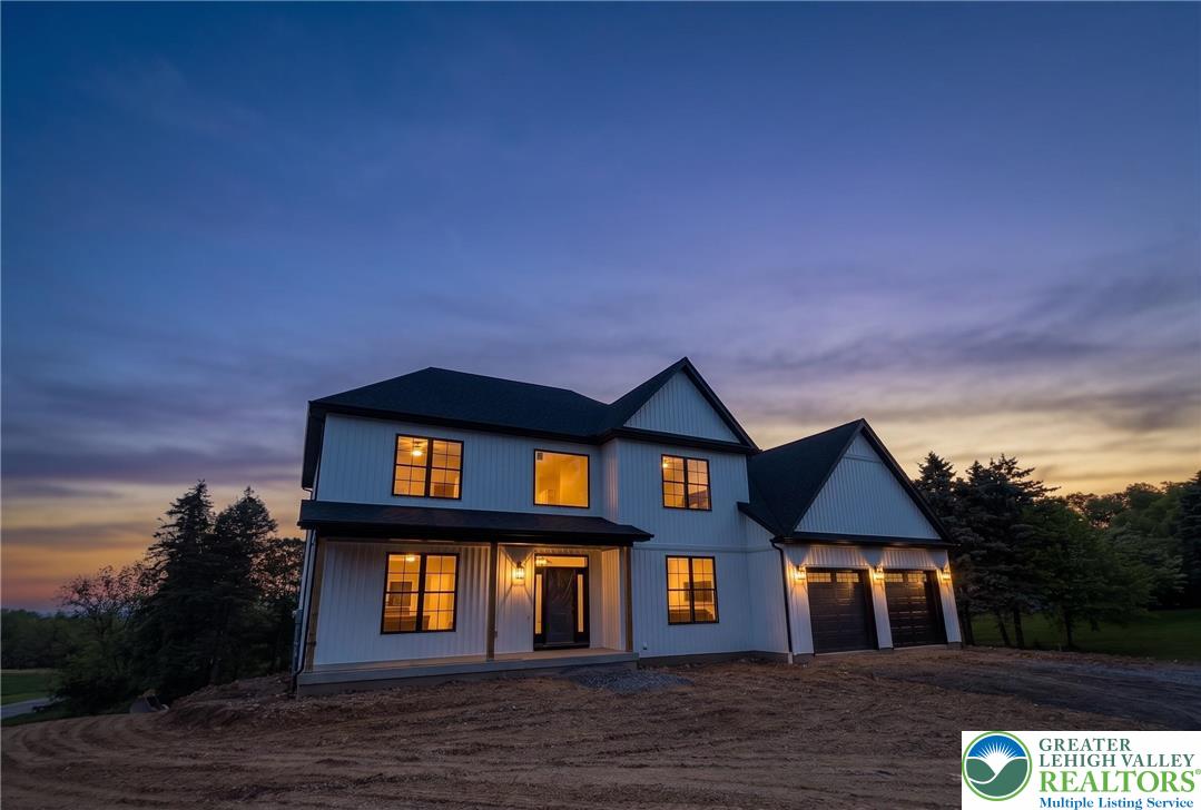 1899 Kecks Road Breinigsville, PA 18031 - Photo 3 of 30 This newly constructed home features striking. AI Rendering
modern farmhouse architecture under a dramatic evening sky.