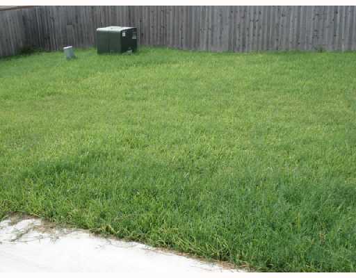 1122 Livermore Street Portland, TX 78374 - Photo 9 of 10 a backyard of a house