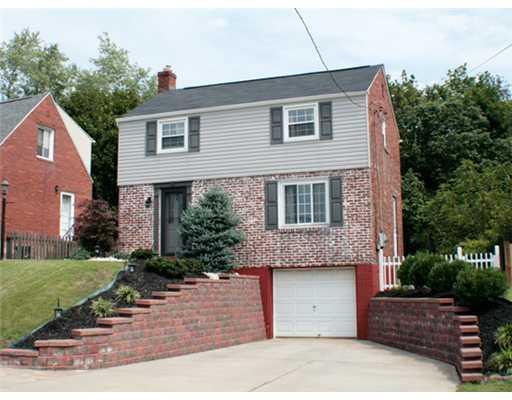 831 Rolling Rock Road Pittsburgh, PA 15234 - Photo 16 of 16 Exterior Front. Large driveway provides plenty of additional parking. New retaining walls and landscaping 2007.