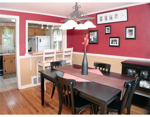 831 Rolling Rock Road Pittsburgh, PA 15234 - Photo 4 of 16 Dining Room. Nice dining room with hardwood floors and chair rail. Opening from dining room to kitchen makes both rooms feel bigger.