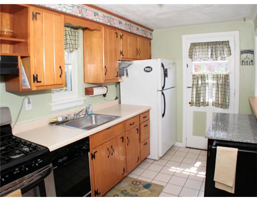 831 Rolling Rock Road Pittsburgh, PA 15234 - Photo 6 of 16 Kitchen. Nice kitchen with ceramic tile floor. Door to back yard. All appliances stay. Stainless steel stove.