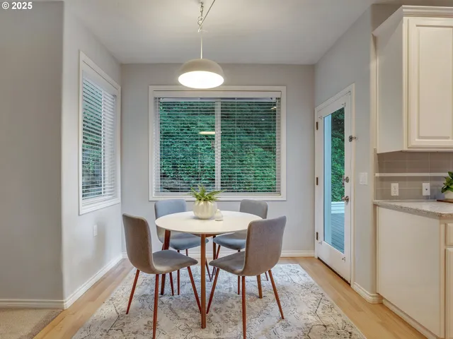 a view of a dining room with furniture window and outside view