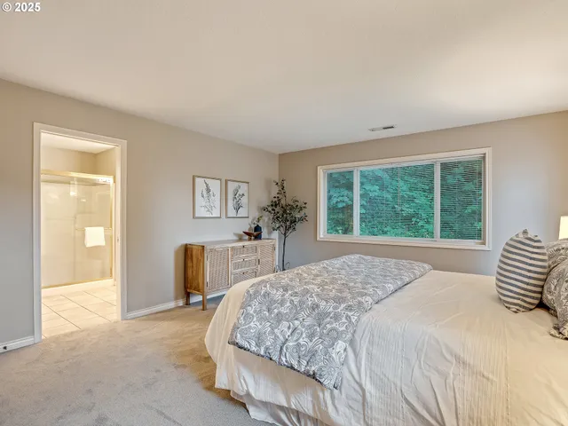 a bathroom with a tub sink and shower