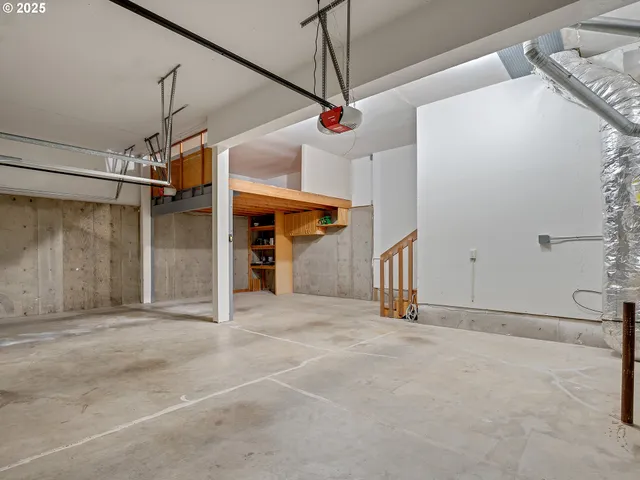 a view of a house with a yard and wooden fence