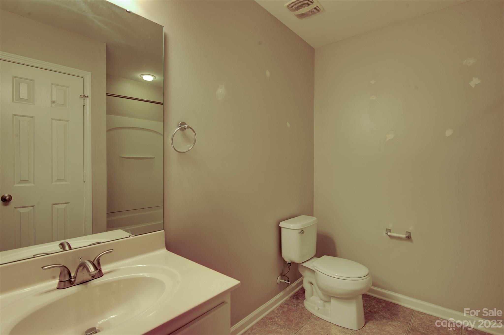 9201 Seamill Road Charlotte, NC 28278 - Photo 14 of 23 a bathroom with a sink and a toilet