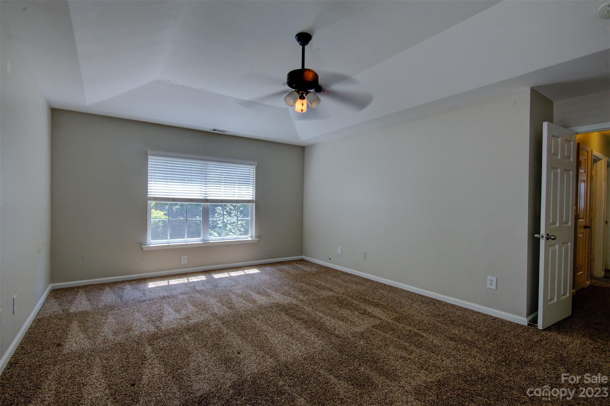 9201 Seamill Road Charlotte, NC 28278 - Photo 17 of 23 an empty room with windows and fan