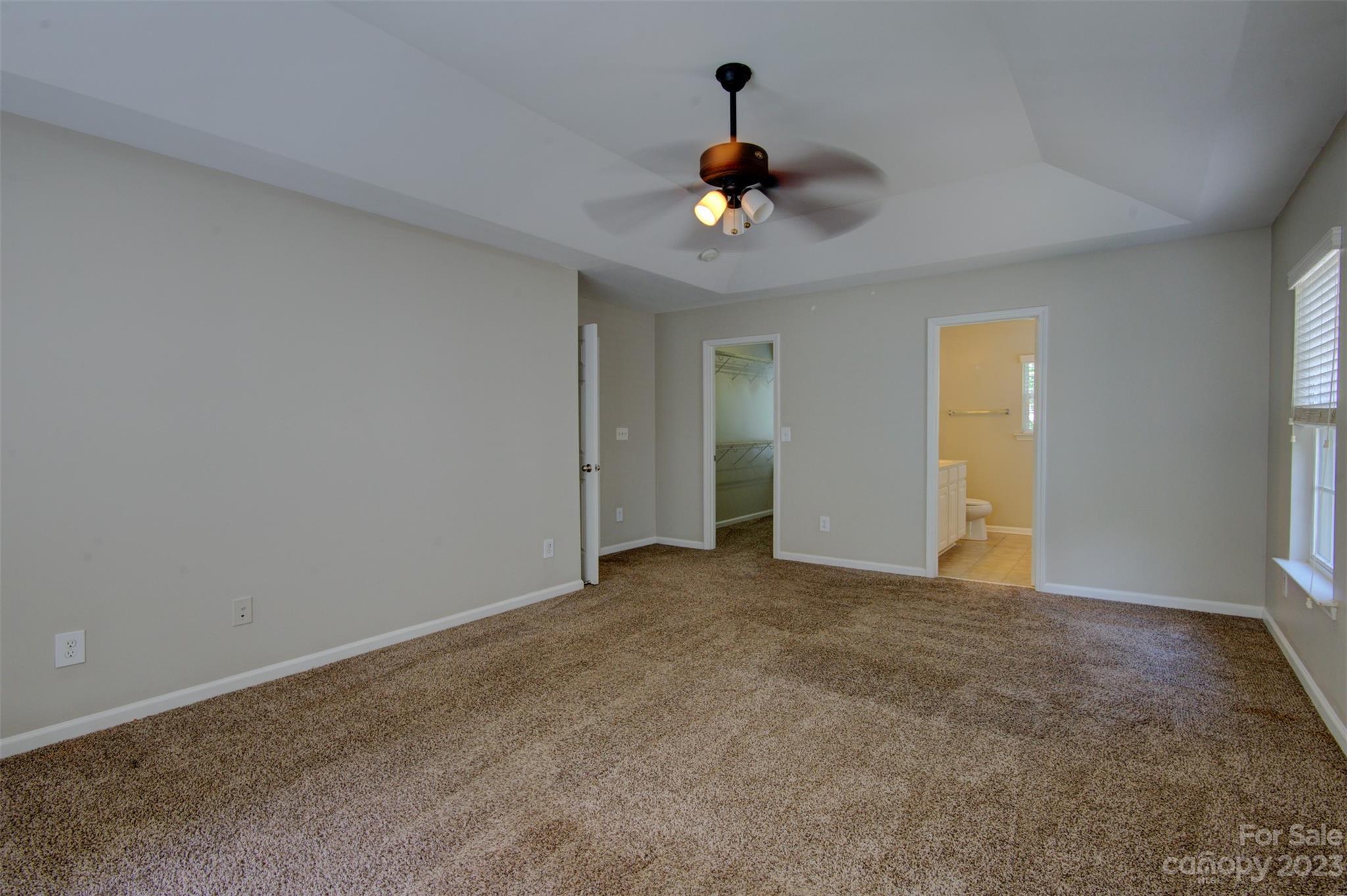 9201 Seamill Road Charlotte, NC 28278 - Photo 18 of 23 a view of an empty room with a chandelier fan