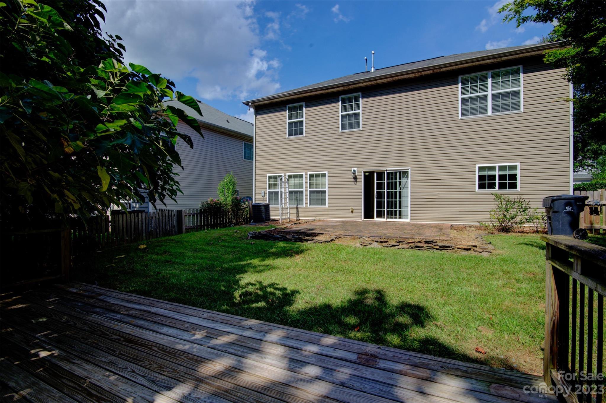 9201 Seamill Road Charlotte, NC 28278 - Photo 20 of 23 a backyard of a house with plants and garden