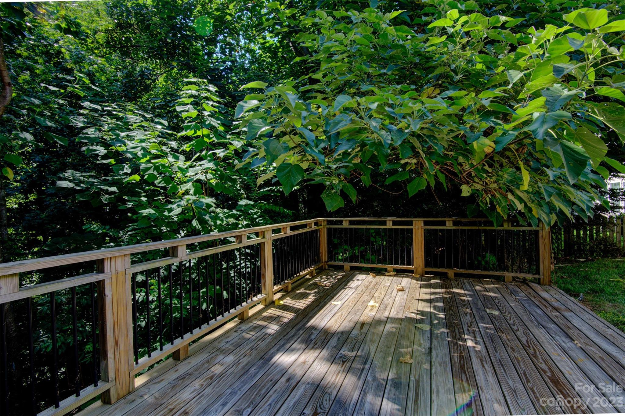 9201 Seamill Road Charlotte, NC 28278 - Photo 21 of 23 a view of balcony with wooden floor and fence