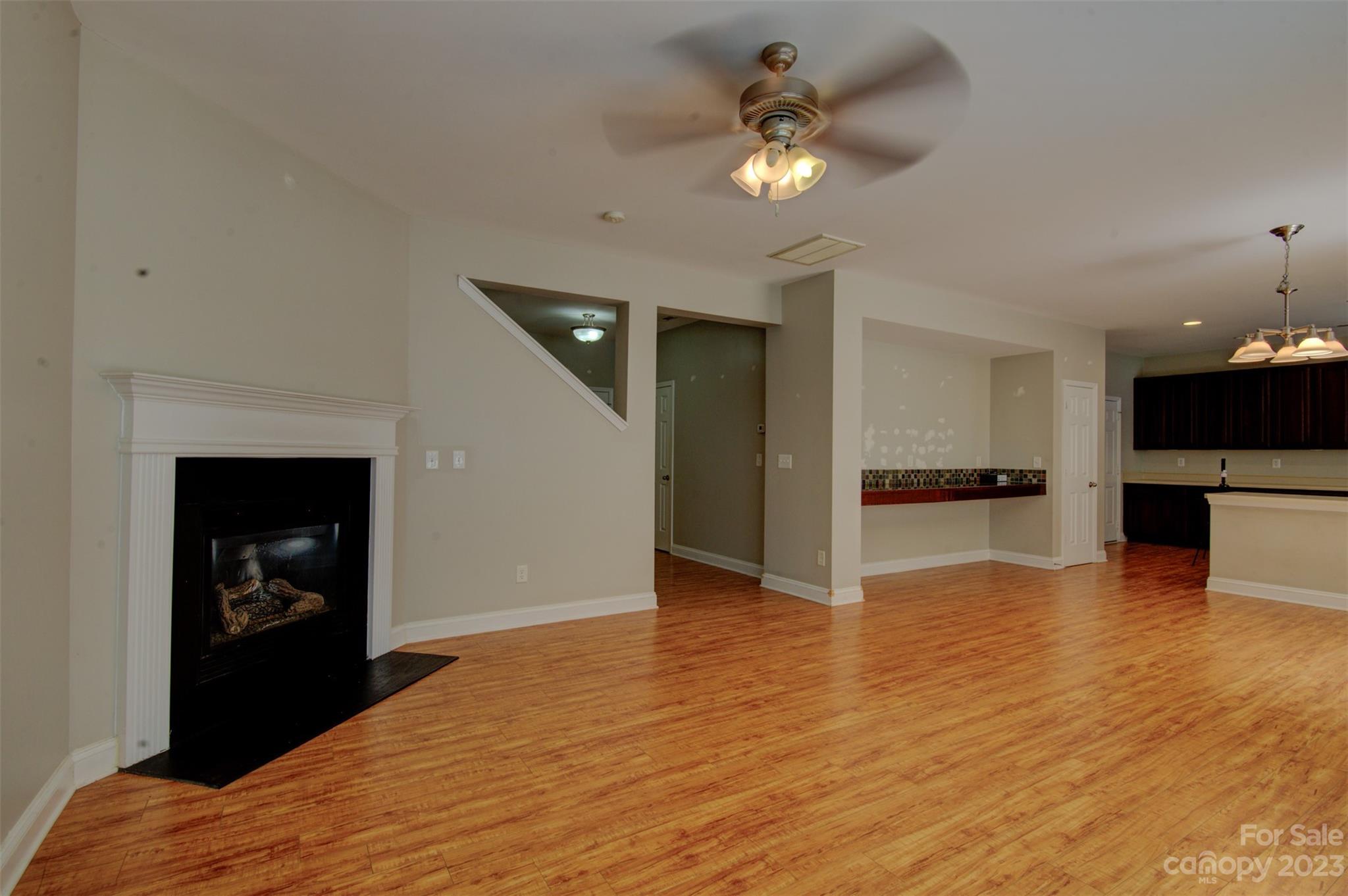 9201 Seamill Road Charlotte, NC 28278 - Photo 4 of 23 a view of kitchen living room with microwave and furniture