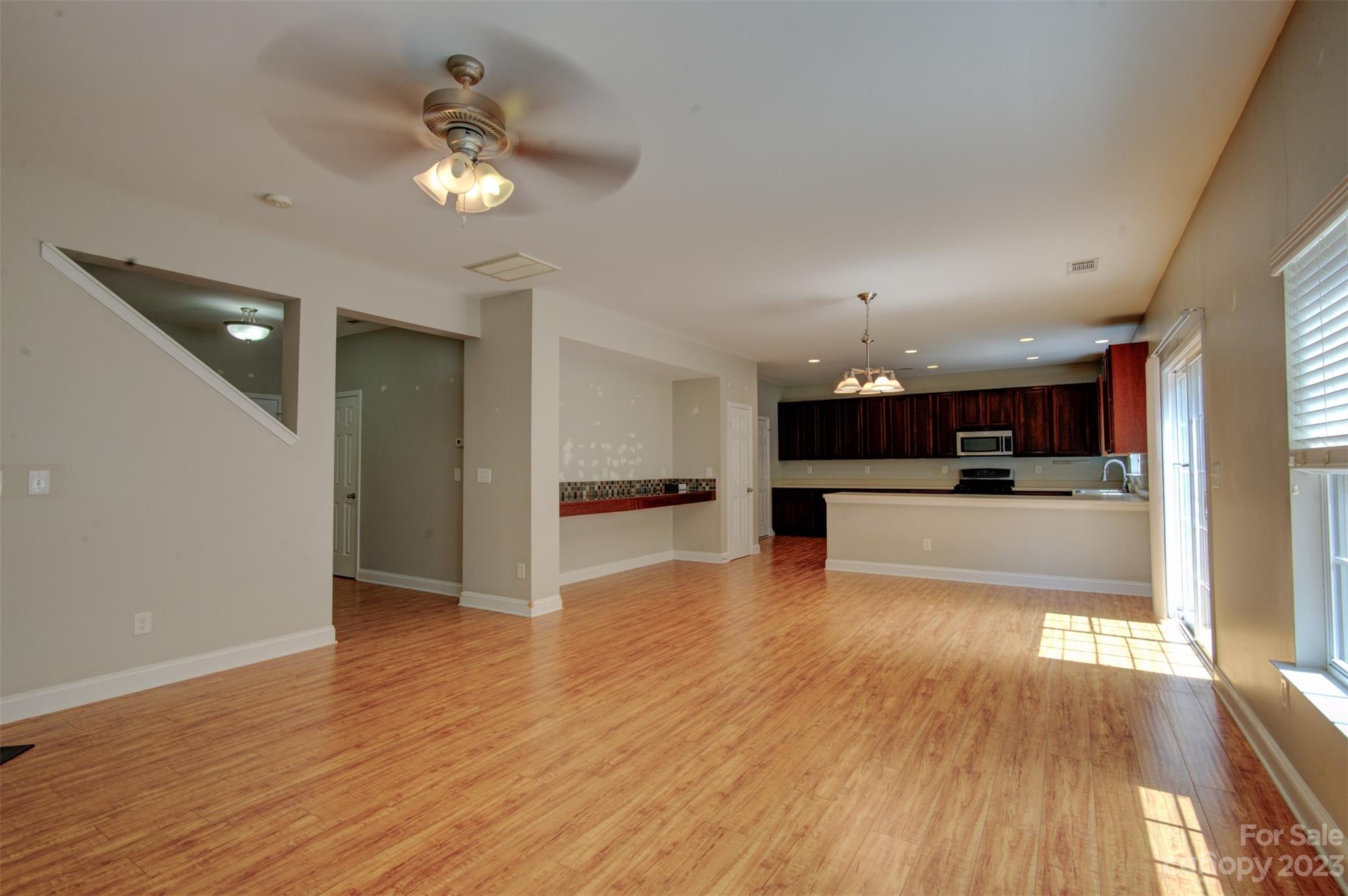 9201 Seamill Road Charlotte, NC 28278 - Photo 5 of 23 a view of kitchen with cabinets and wooden floor