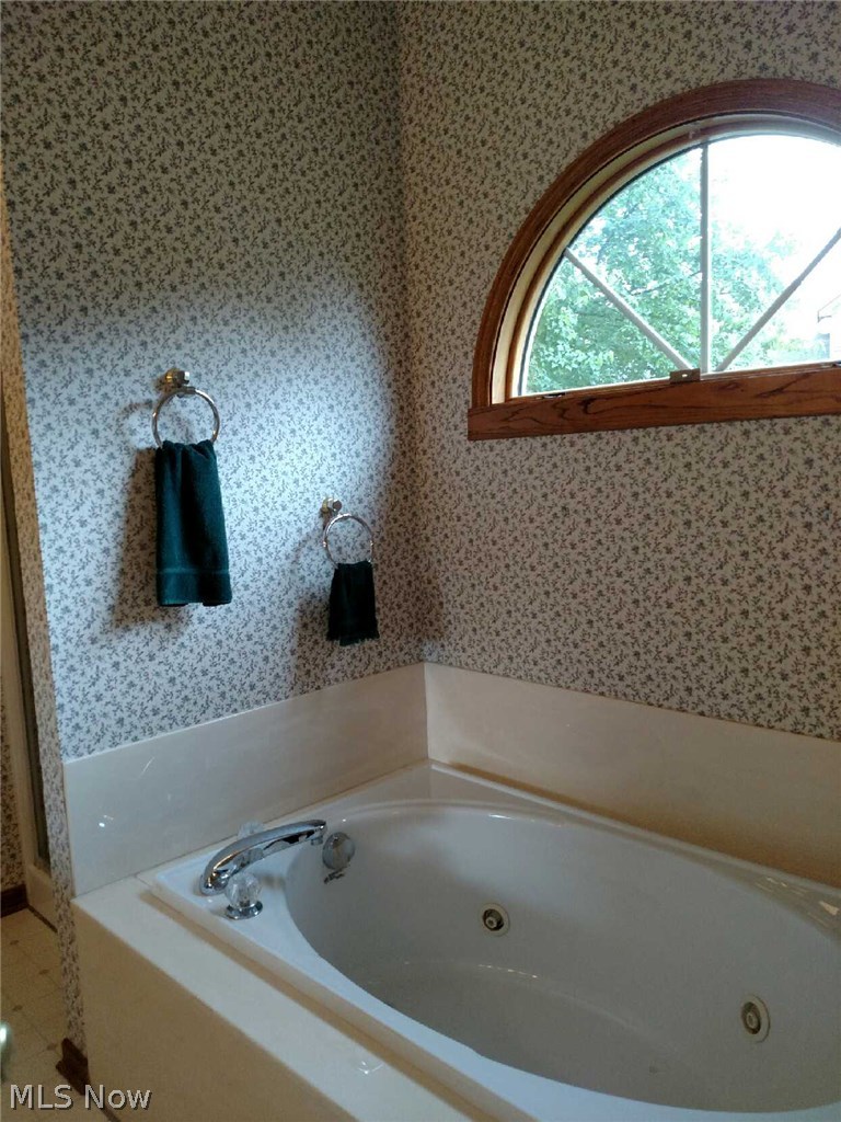 2608 Charing Cross Road Northwest Canton, OH 44708 - Photo 15 of 24 Spa tub with Palladian window is perfect for a relaxing evening before bed.