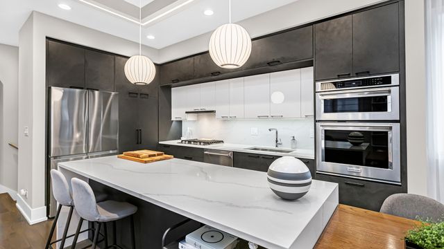 a kitchen with a table and chairs