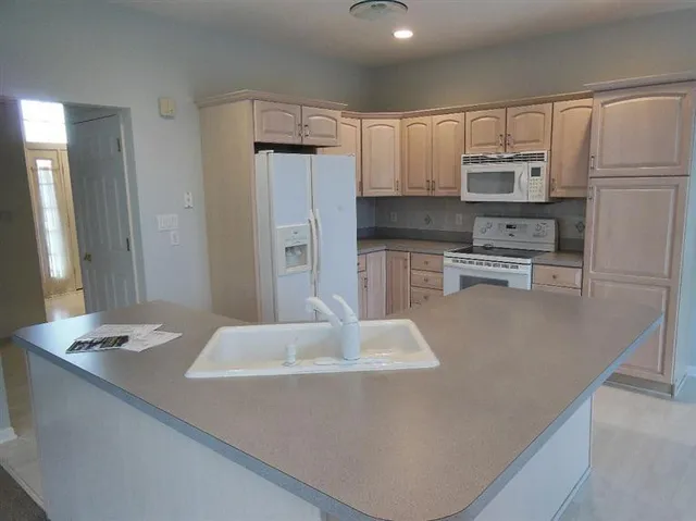 a kitchen with stainless steel appliances