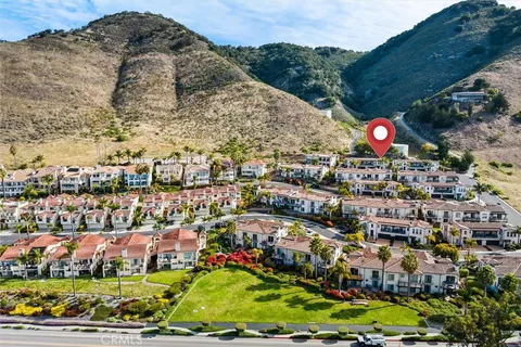 an aerial view of residential building and ocean