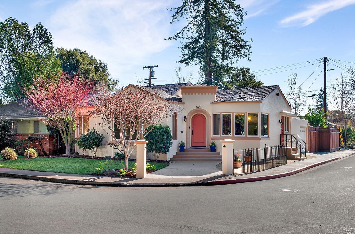 a front view of house with yard and green space