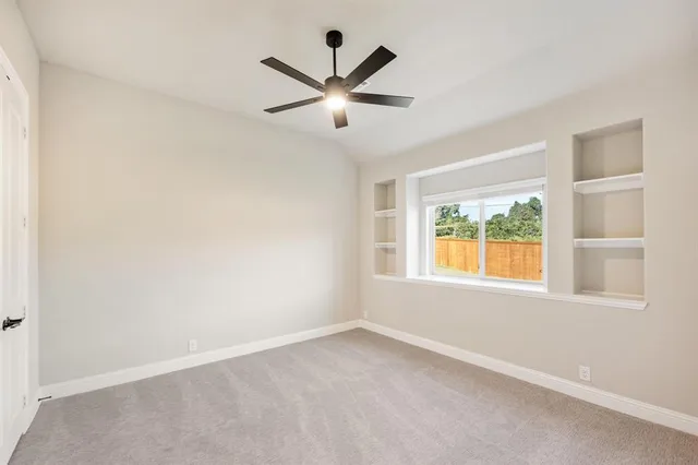 an empty room with window and windows