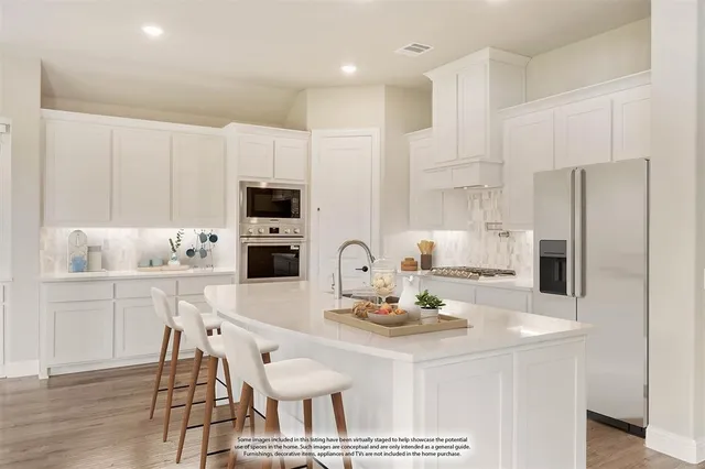 a kitchen with a dining table and chairs