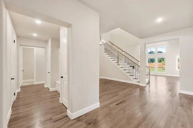 a view of an entryway with wooden floor