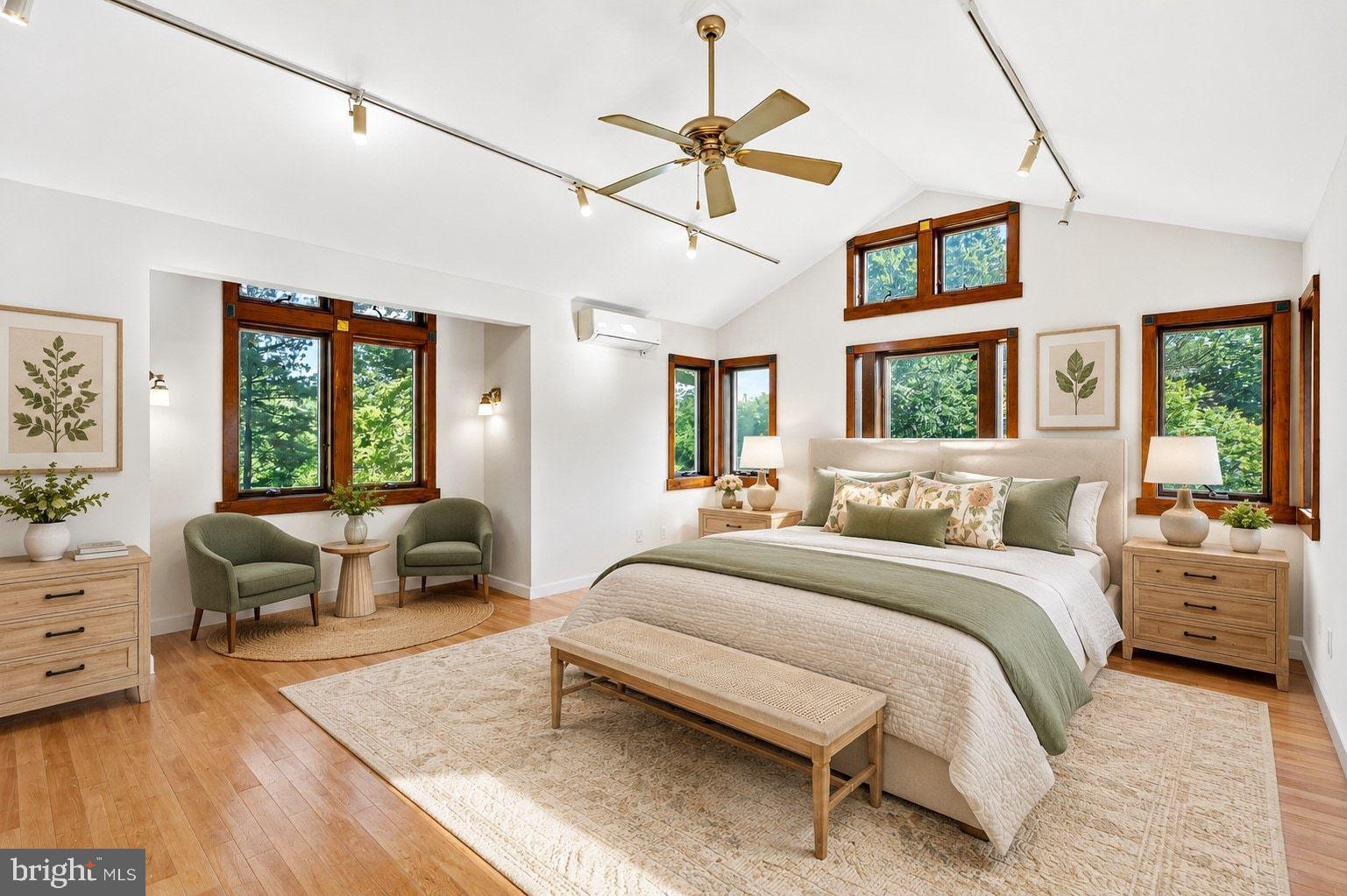 498 Perrineville Road Robbinsville, NJ 08691 - Photo 32 of 59 a spacious bedroom with a bed a couch and a window