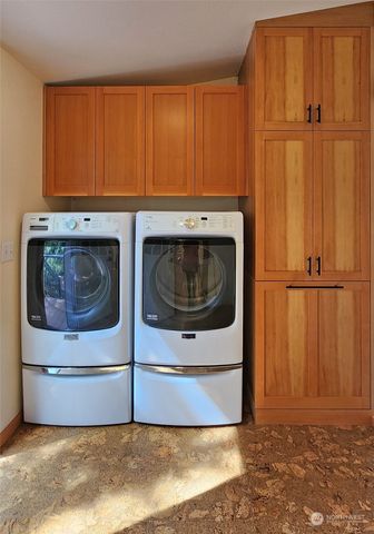 a utility room with wooden floor