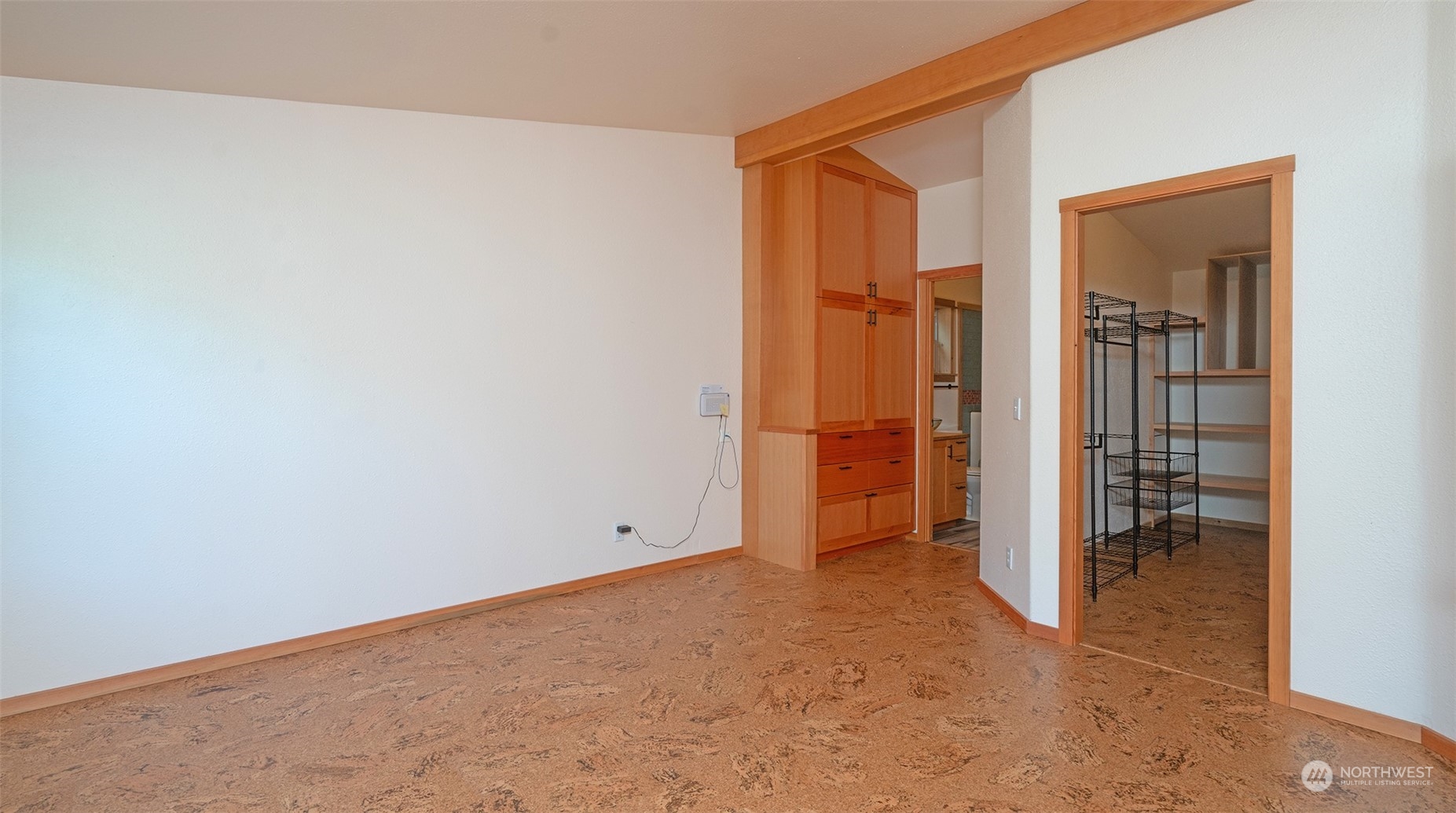 653 Shark Reef Road Lopez Island, WA 98261 - Photo 15 of 33 an empty room with closet and a hallway