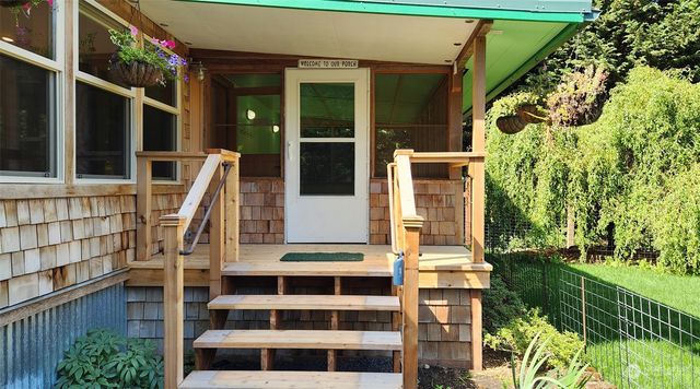 front view of large building with a yard