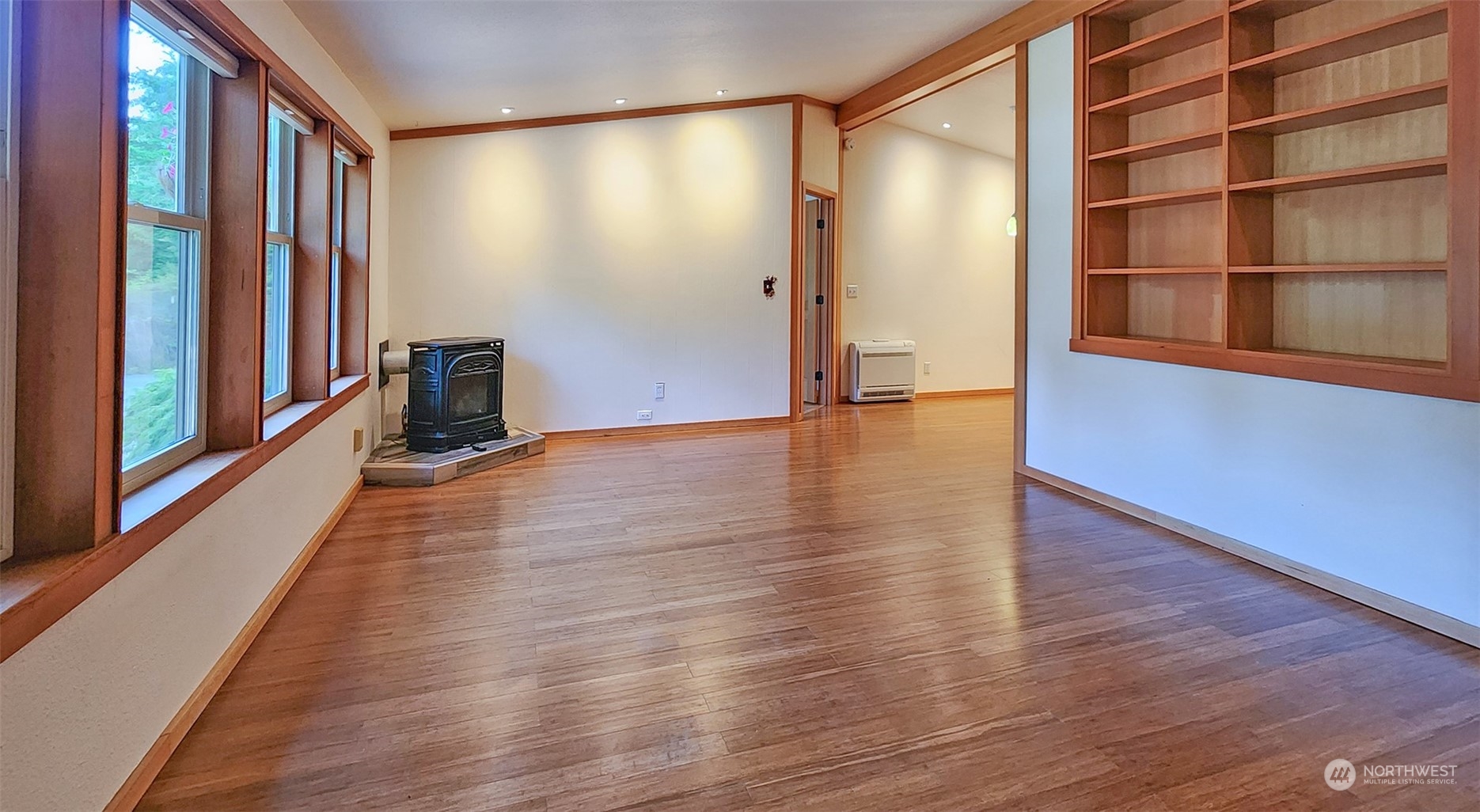 653 Shark Reef Road Lopez Island, WA 98261 - Photo 6 of 33 a view of an empty room with wooden floor and a window