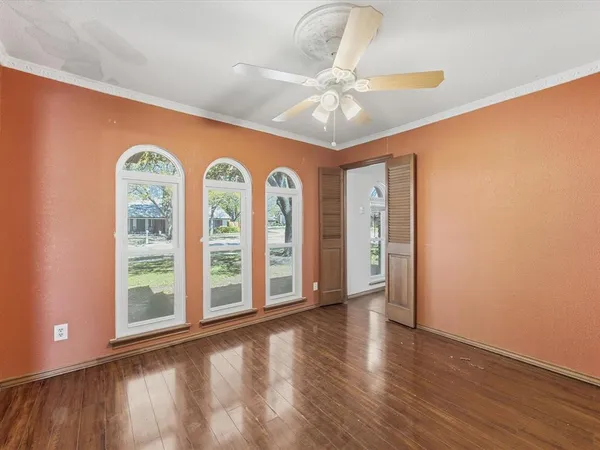 a view of an entryway with wooden floor