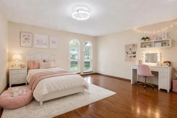 a bedroom with a bed and a table in it