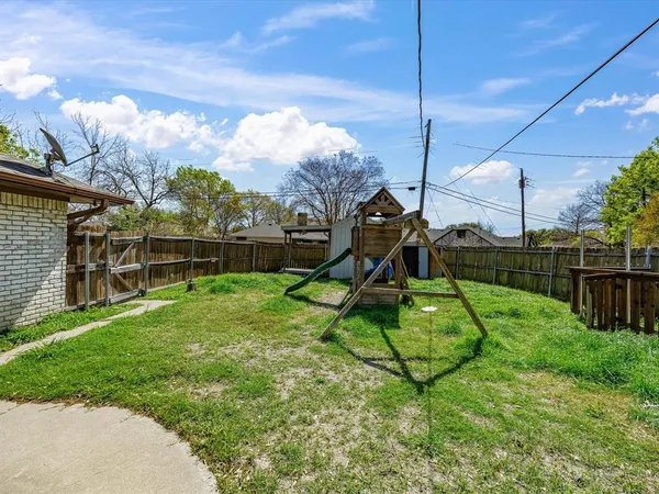a view of a backyard with slide