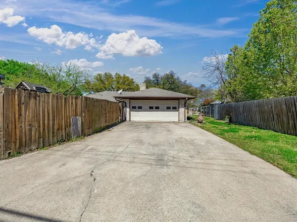 a view of house with backyard and deck
