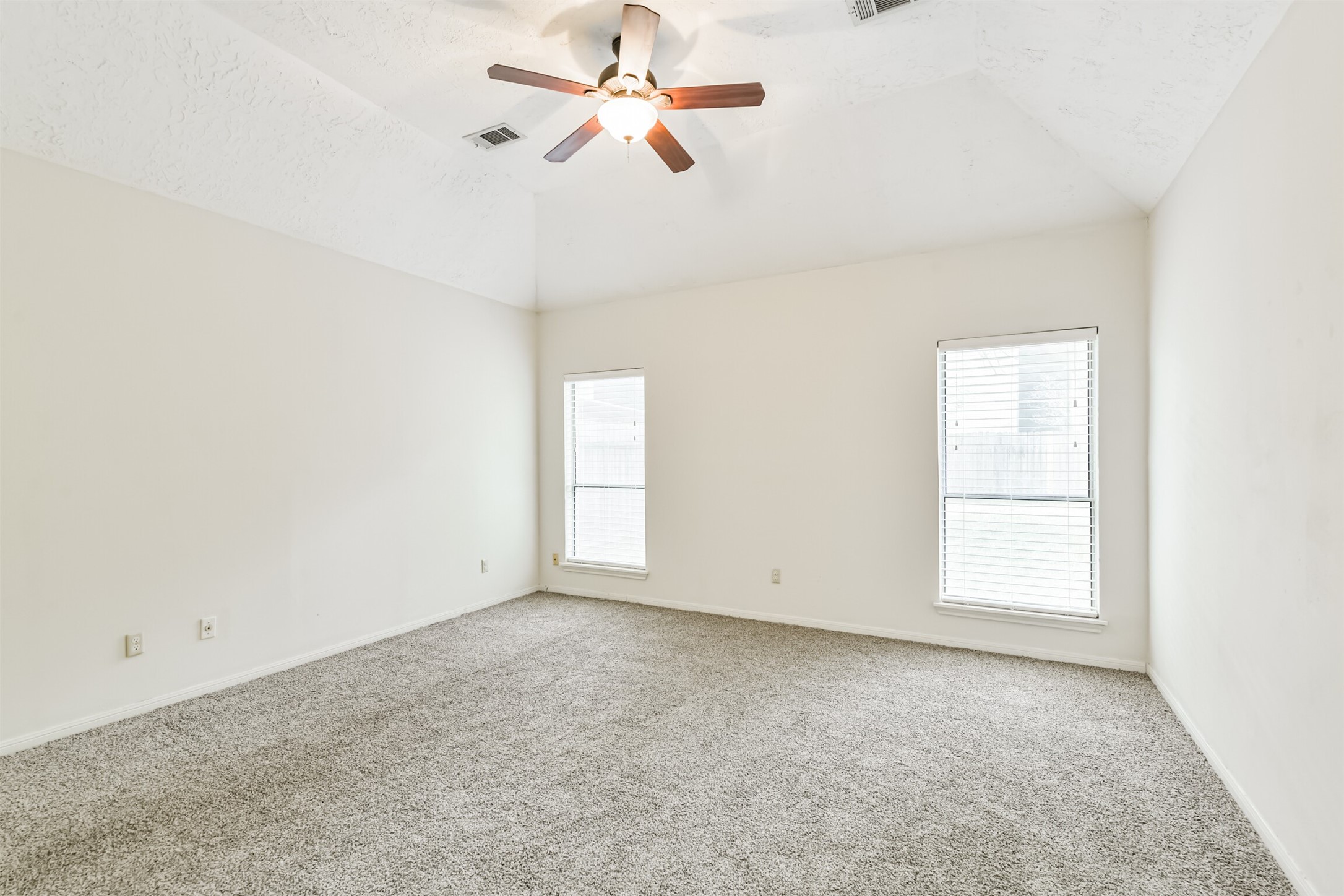 13626 Cedar Point Drive Cypress, TX 77429 - Photo 16 of 34 an empty room with windows and fan