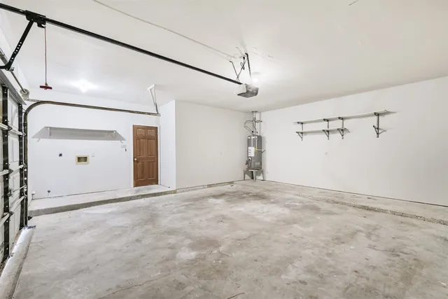 a view of a house with yard and a garden