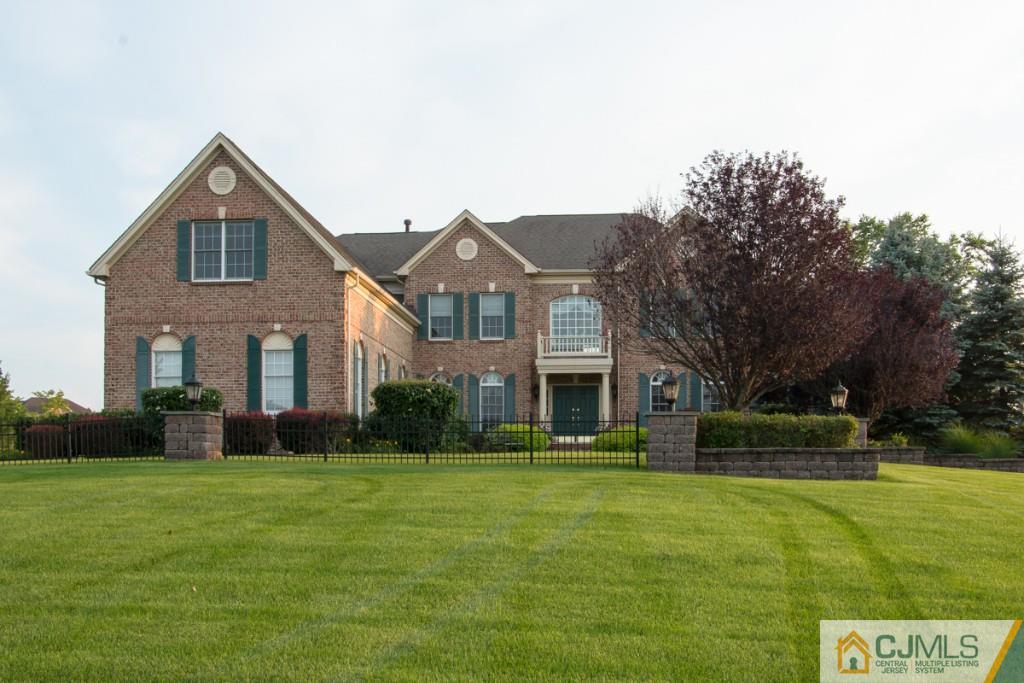 1 Baker Way Pennington, NJ 08534 - Photo 2 of 25 a front view of house with yard and green space