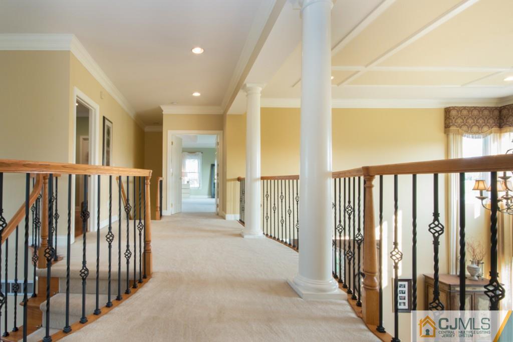 1 Baker Way Pennington, NJ 08534 - Photo 12 of 25 a view of a hallway with wooden floor and entryway
