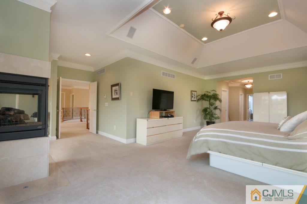 1 Baker Way Pennington, NJ 08534 - Photo 17 of 25 a living room with furniture and a flat screen tv