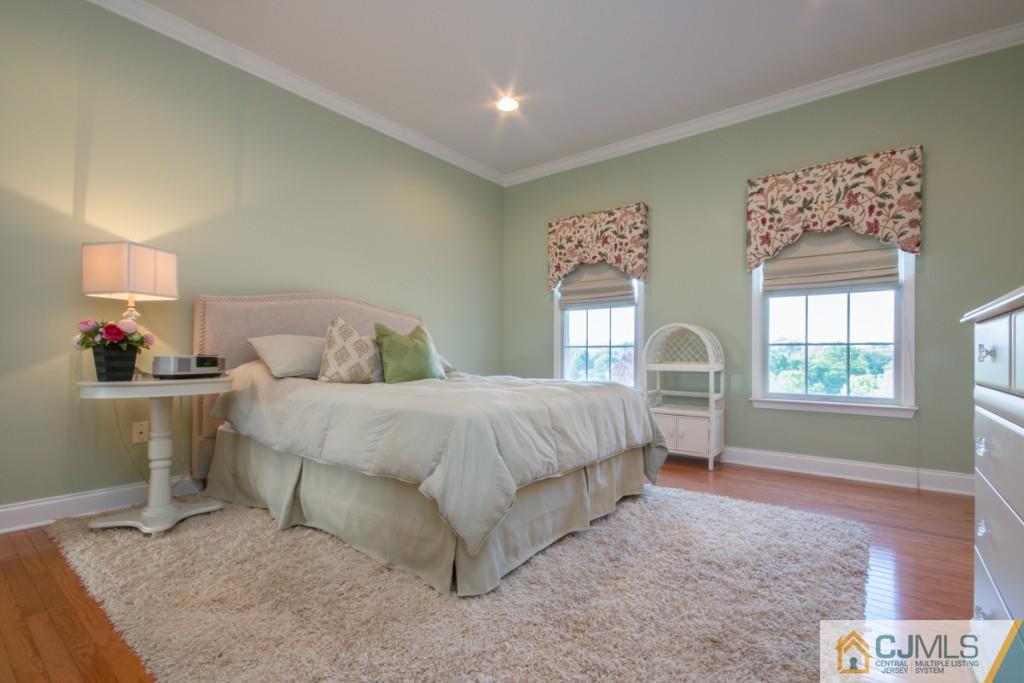 1 Baker Way Pennington, NJ 08534 - Photo 19 of 25 a spacious bedroom with a bed and a window