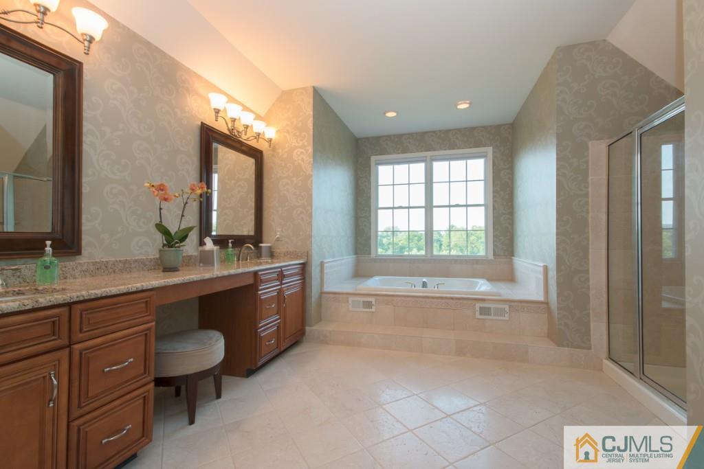 1 Baker Way Pennington, NJ 08534 - Photo 20 of 25 a bathroom with a granite countertop sink and a bathtub