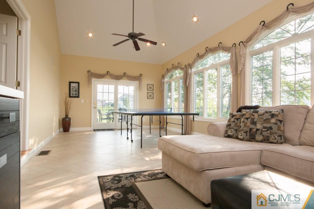 1 Baker Way Pennington, NJ 08534 - Photo 7 of 25 a living room with furniture and a large window